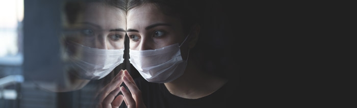 A woman with a medical mask in a Psychiatric Hospital