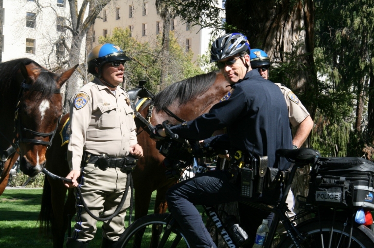 Photo of mounted police. 