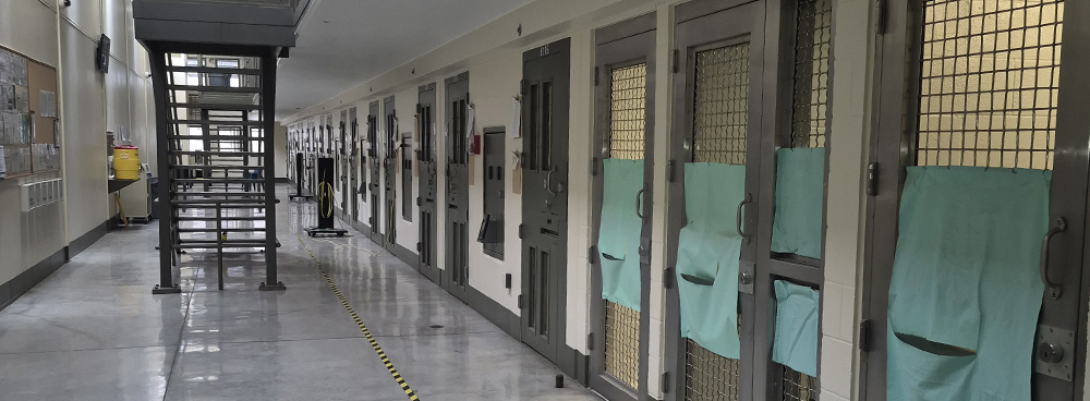 Posterior Segregation Unit showing a long hallway with cell doors along one side