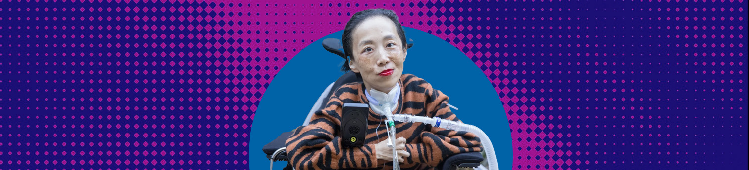Alice Wong sitting in her assisted wheelchair