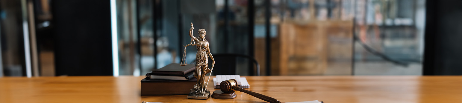 Statue of Lady Justice with a gavel.