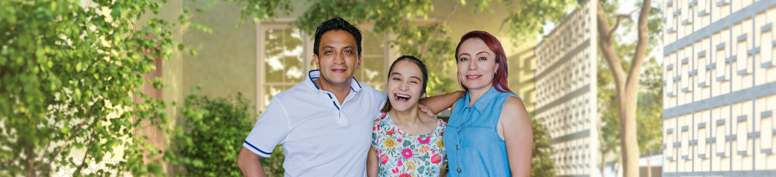 A hispanic father and mother smiling with their daughter between them. Their daughter has autism and is also smiling.