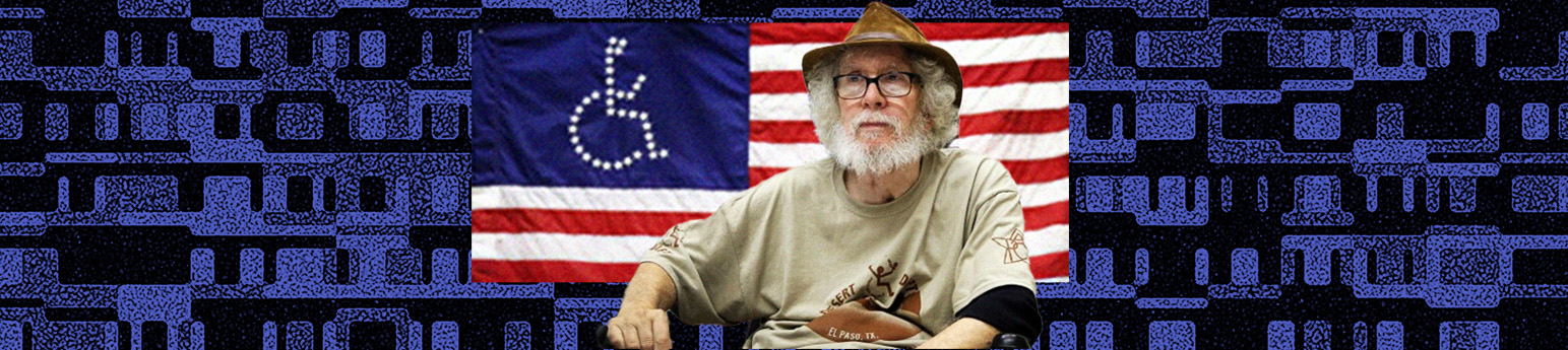 A photo of Bob Kafka in his wheelchair with an American flag above him.
