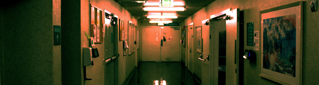 The water fountain hallway of inside college, with hues of greens and orange