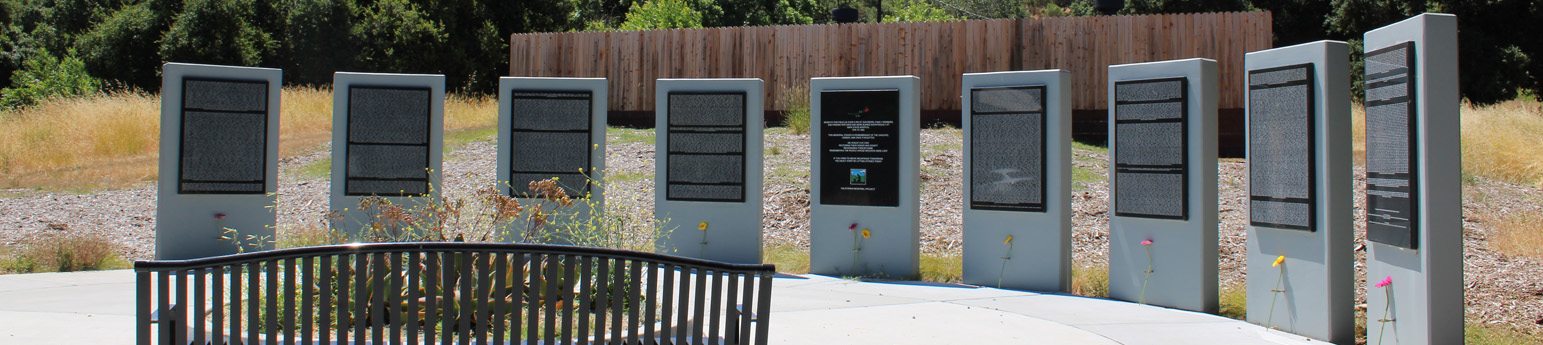 Memorial of 9 tall stone rectangle shaped monuments in dedication to those who lived and died in state hospitals.