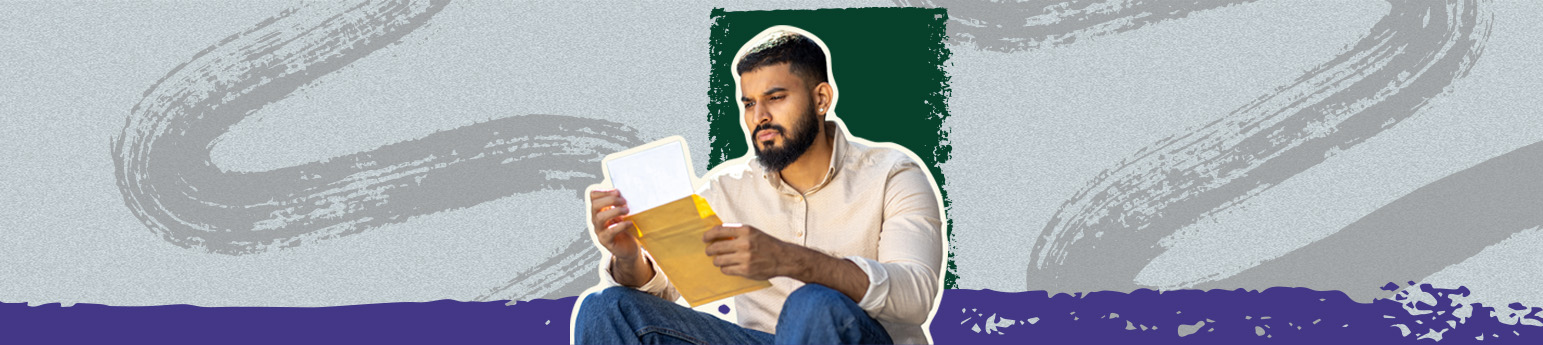 An Indian man with short hair and a beard with a beige button up shirt, reading an eviction notice while looking perplexed.