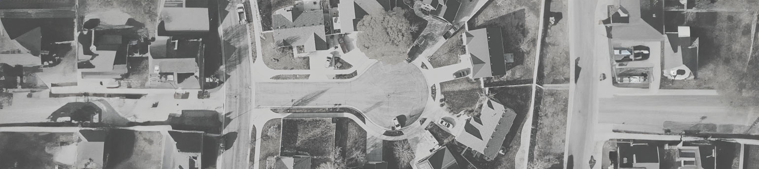 Aerial view of of a street with homes.