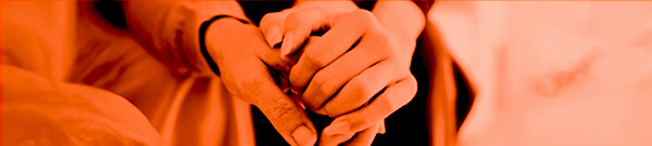 A closeup shot of two hands, holding each other