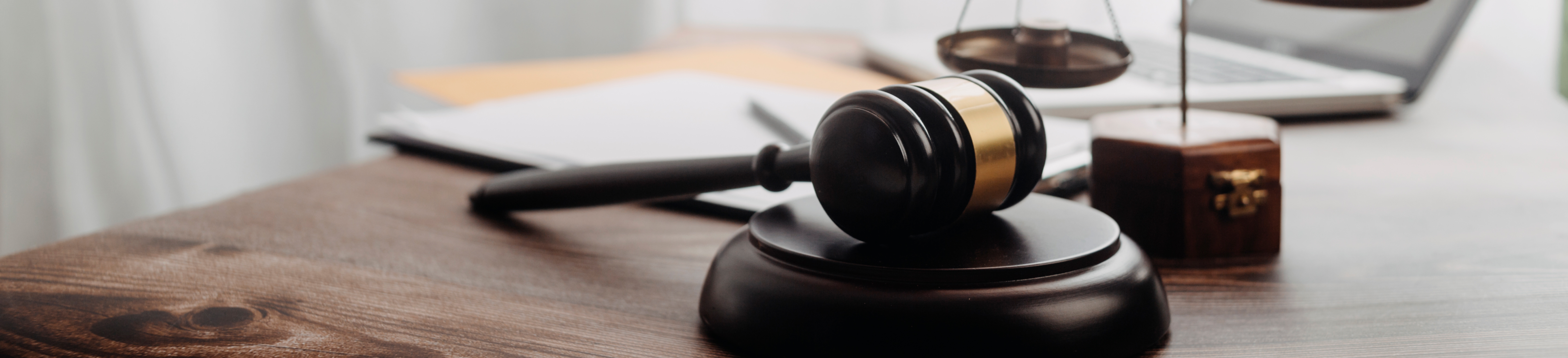 A single gavel on a desk.