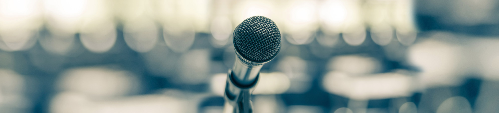 A microphone in front of a crowd.