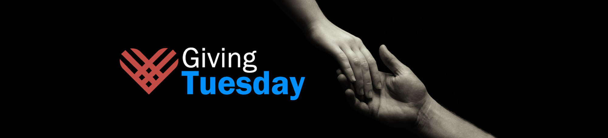 Giving Tuesday - A closeup photo of of a hand reaching out and holding anothers persons hand.