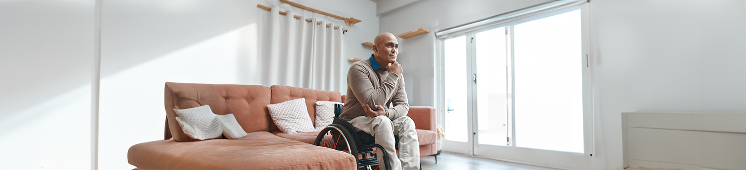 Thoughtful Hispanic senior man reflecting on a decision at home.