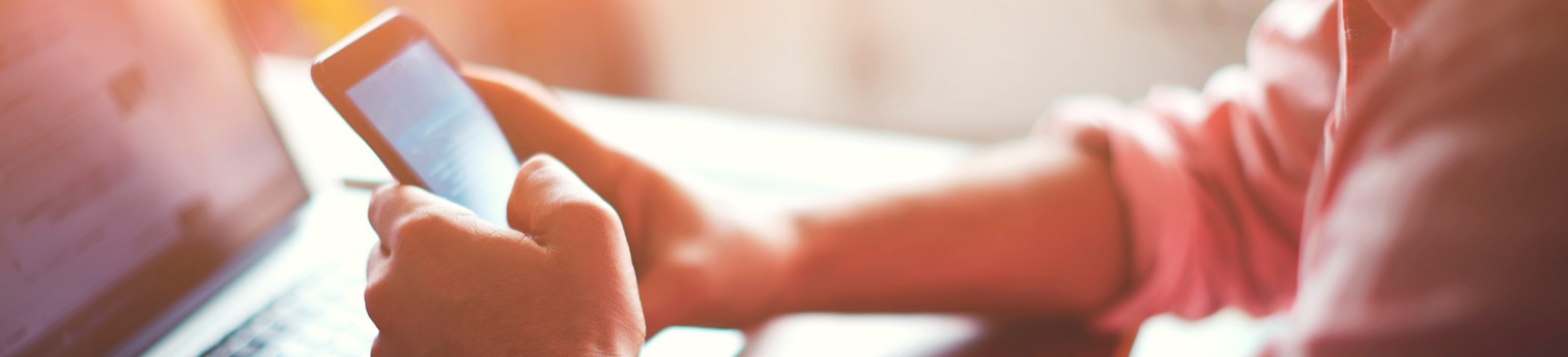 Close up of a woman signing up for the DRC newsletter on her phone.