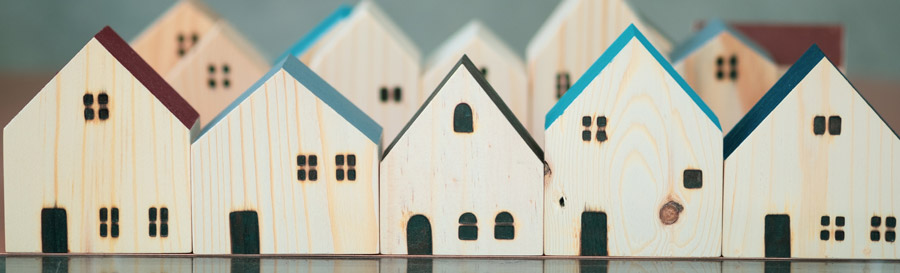 Image of several wooden houses in a row.