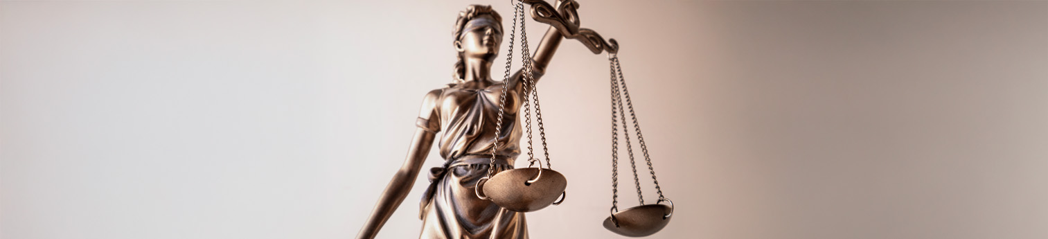 Statue of Lady Justice holding scales of justice