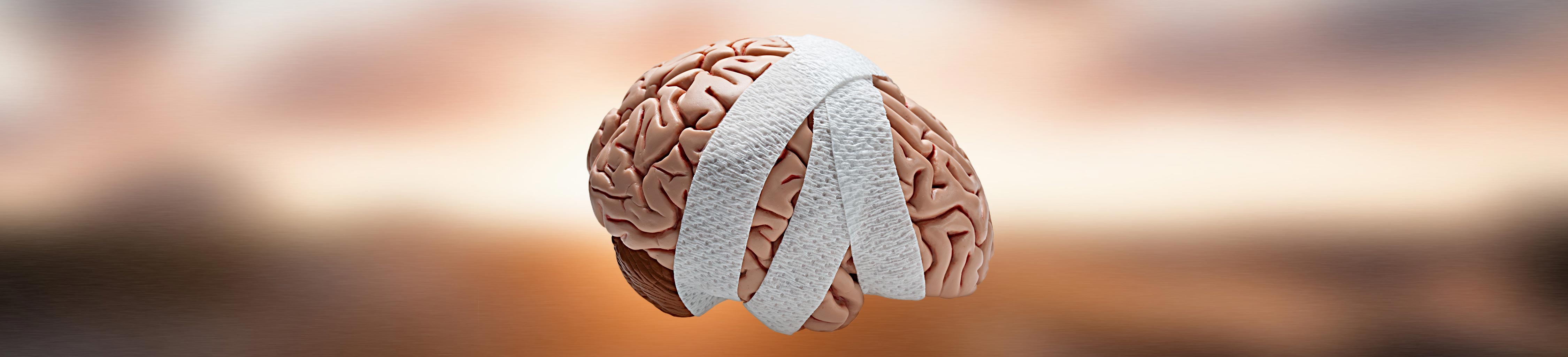 Image of a brain wrapped in a bandage indicating a traumatic brain injury.