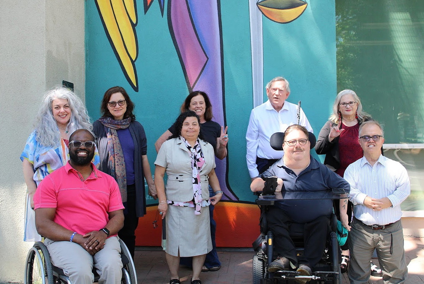 Members of the Alliance standing in a row in front of the DRC Sacramento office.