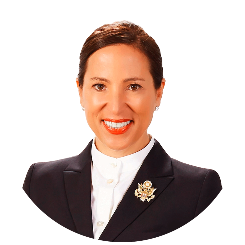 Lt. Governor Eleni Kounalakis, an American Governor wearing a black suit with a big golden militant broach.