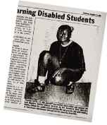 Image of a Newspaper article about Chanda Smith showing a photo of her in scholl kneeling with a basketball in her hand 