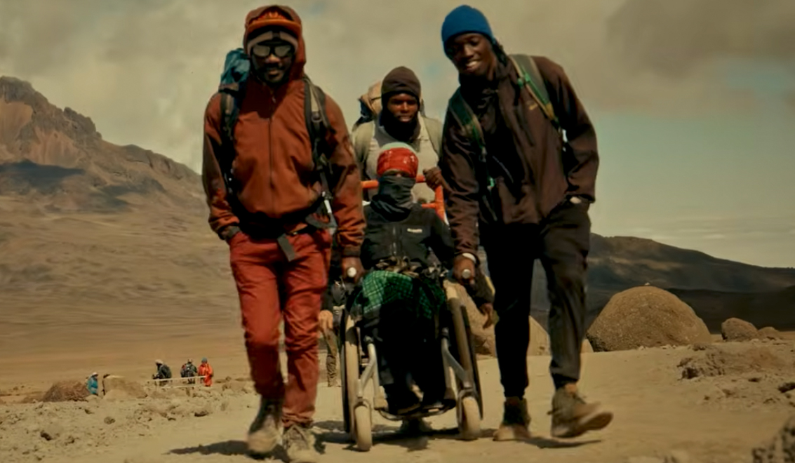 On the way to Kilimanjaro with Erica and her 3 friends fully covered from head to toe in protective wear.