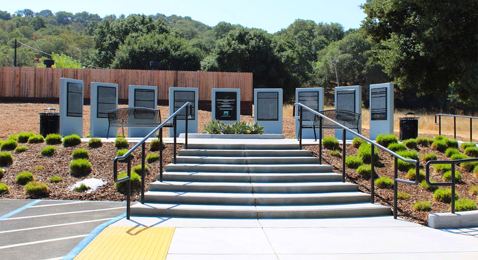 Nine tall monuments in a semi circle. The names of those who died at the hospital are listed on these monuments.