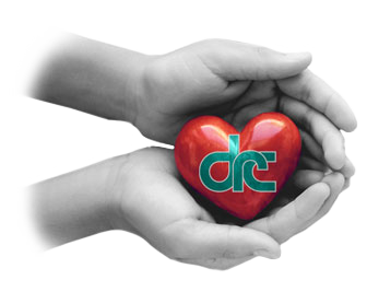 Close up of a child hands holding a heart shaped stone in her out stretched palms.