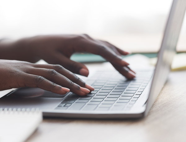 A woman on her laptop using her flexible spending account.