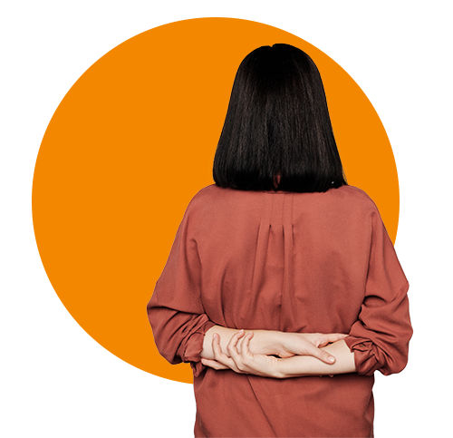 Photo of an asian woman standing with her back to you.