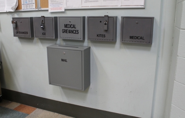 Several boxes on a wall to submit complaints