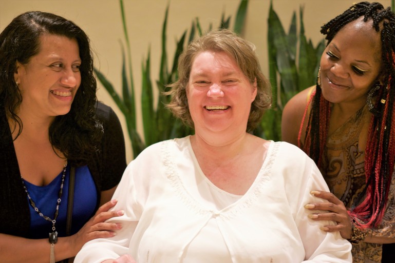 Three women smiling