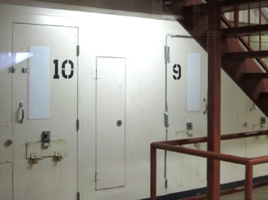 Photo of the solitary confinement door at a Sacramento jail