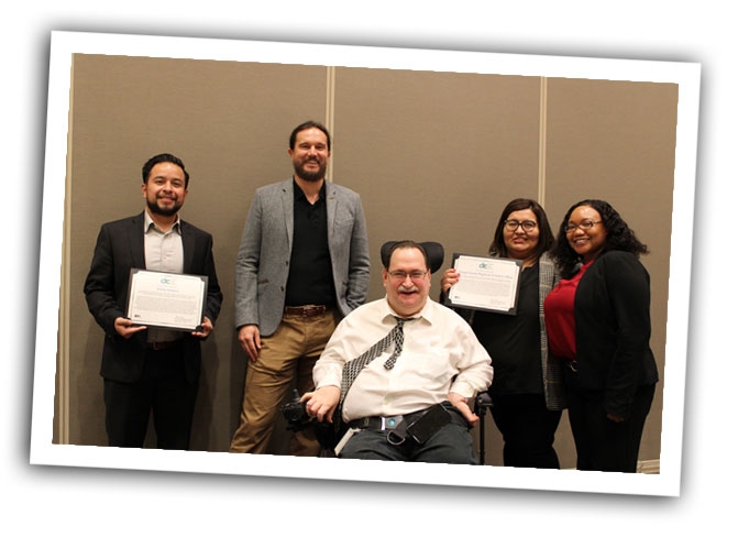DRC employees at an award event for outstanding service to voters with disabilities.