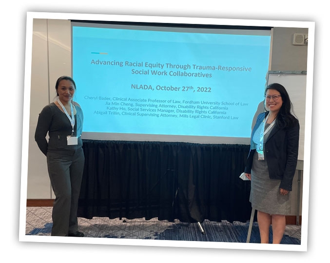 Two DRC employees standing in front of a large monitor wh.le giving a presentation.