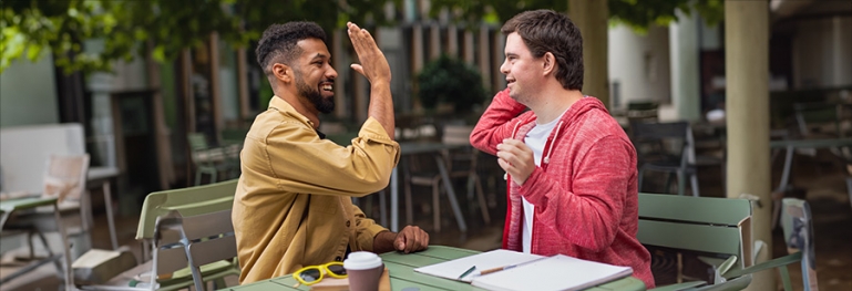 a disable teenager getting extra help after school from a counselor.