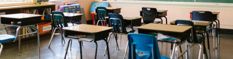 An empty classroom of desks.