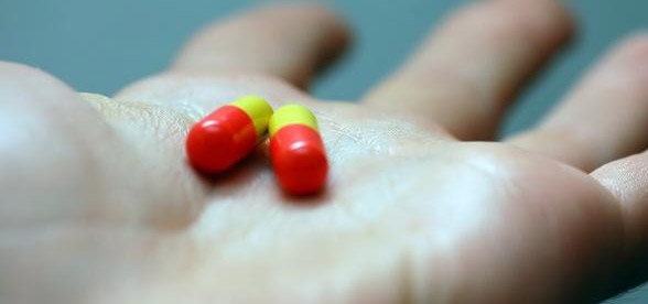 Photo from 40th story showing a pills in the palm of a hand