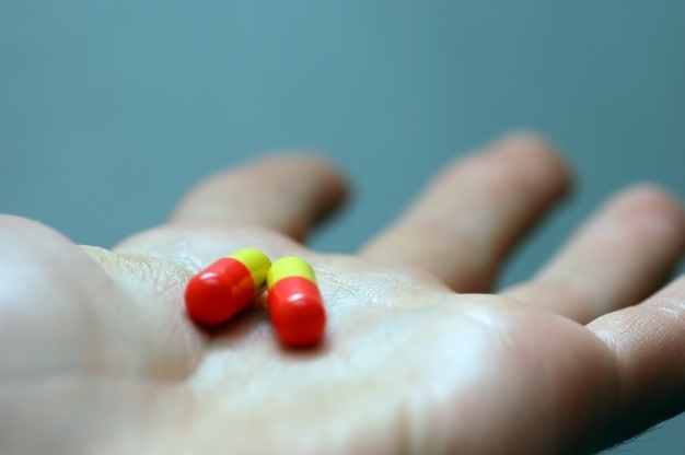 Stock photo of a hand with pills.